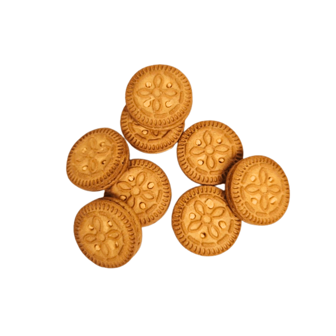 Stack of round Parle Kreams Gold Orange Cookies with decorative patterns on a white background