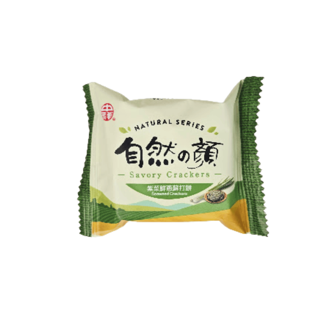 A green package of seaweed crackers with images of seaweed and green onions, featuring text in both English and Chinese.