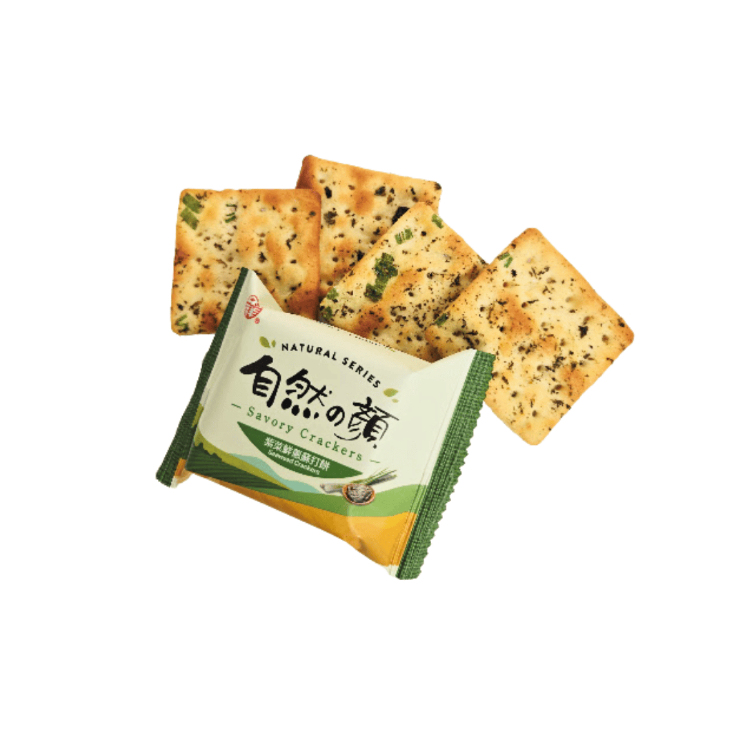 A green package of seaweed crackers with images of seaweed and green onions, with 4 crackers coming out of the package.