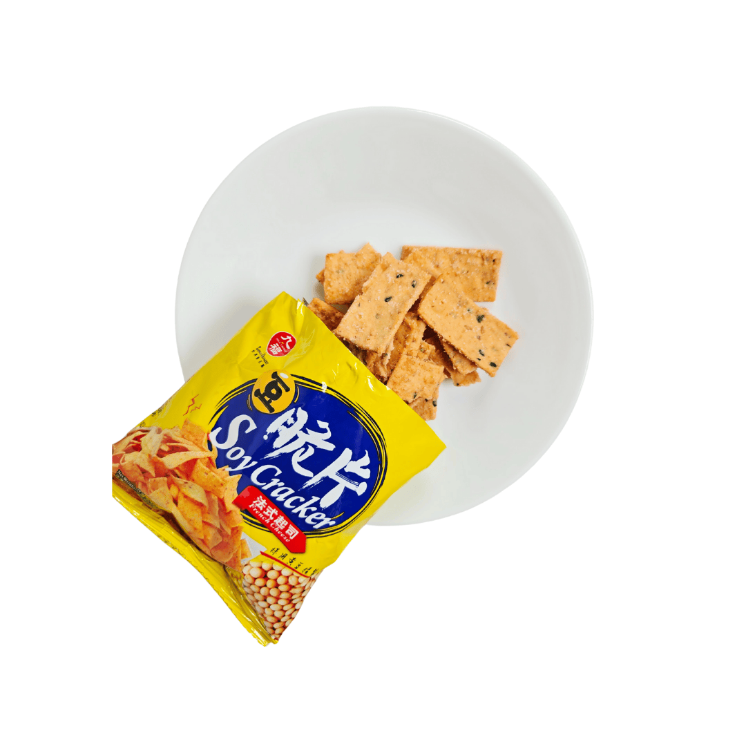 Open bag of Liang Dessert Soy Crackers with French cheese flavor, displayed on a white plate with crispy, rectangular soy crackers spilling out.