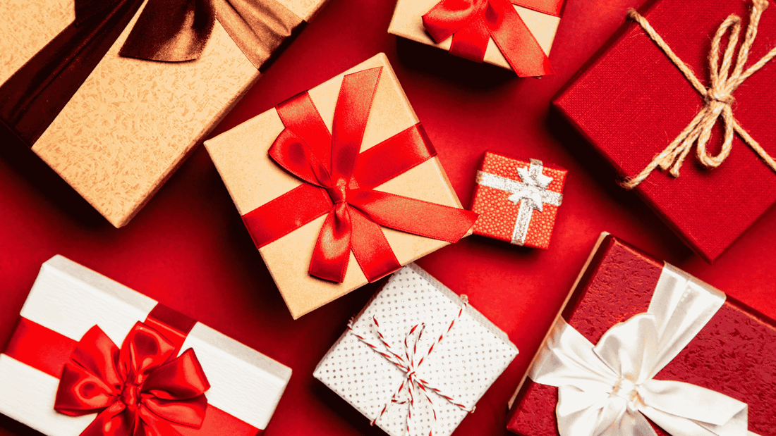 Red background with 8 gift boxes wrapped in ribbons and each box in a different size