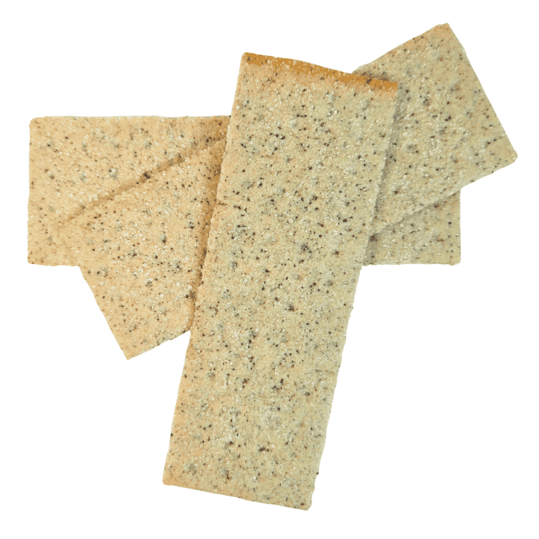 Three rectangular butter cream ube crackers with a speckled texture on a white background