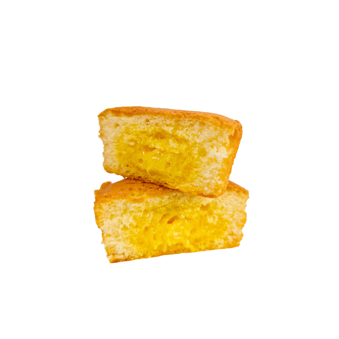 Two pieces of the custard soft cake on a white background