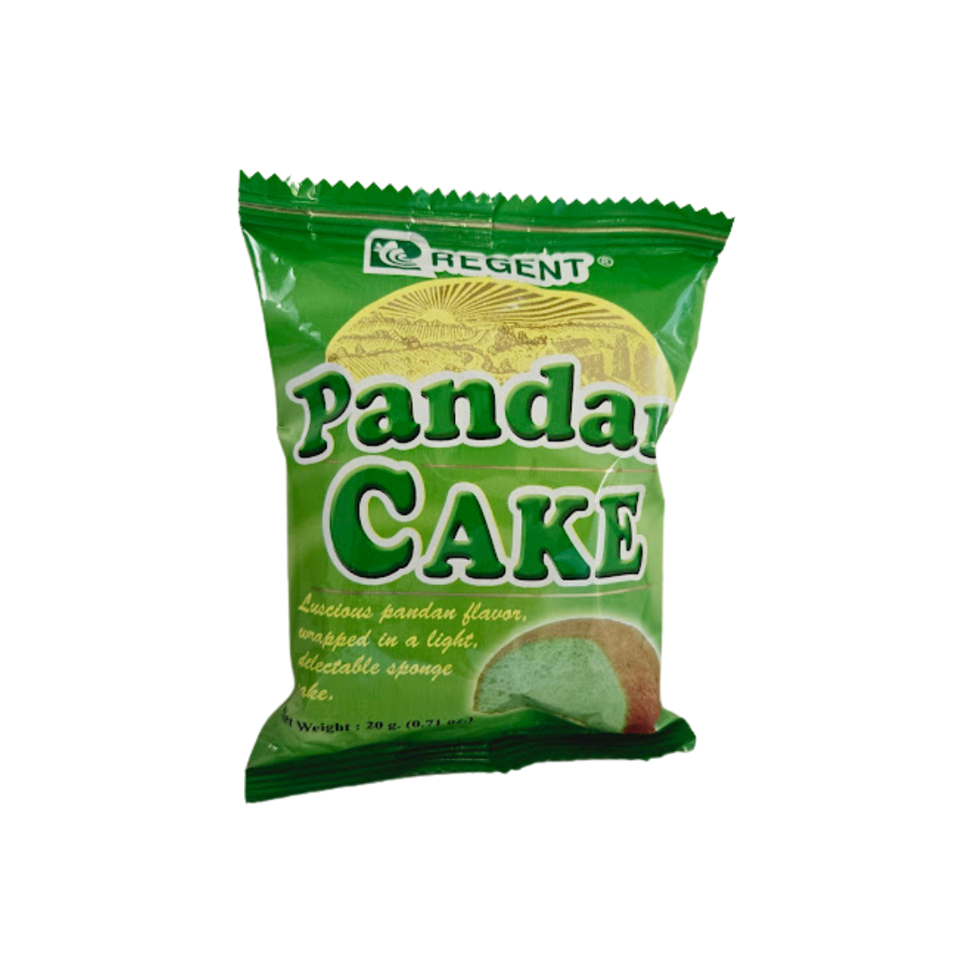 A package of Regent Pandan Cake featuring a green wrapper with an image of the sponge cake inside. The packaging highlights the 'luscious pandan flavor' and describes it as 'wrapped in a light, delectable sponge cake.' Net weight: 20g (0.71 oz).