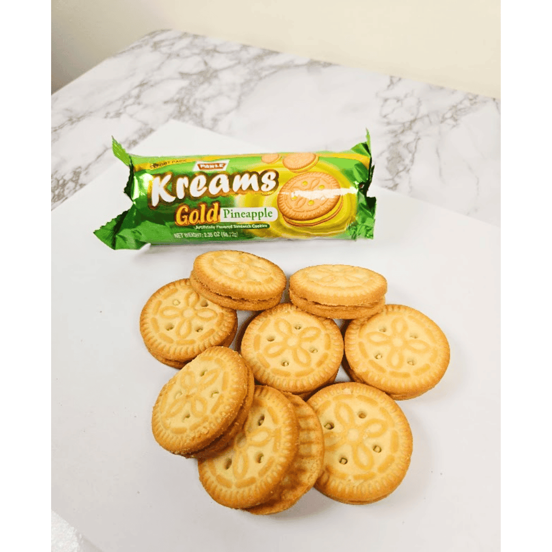 Kreams Gold Pineapple cookies with packaging on a marble surface
