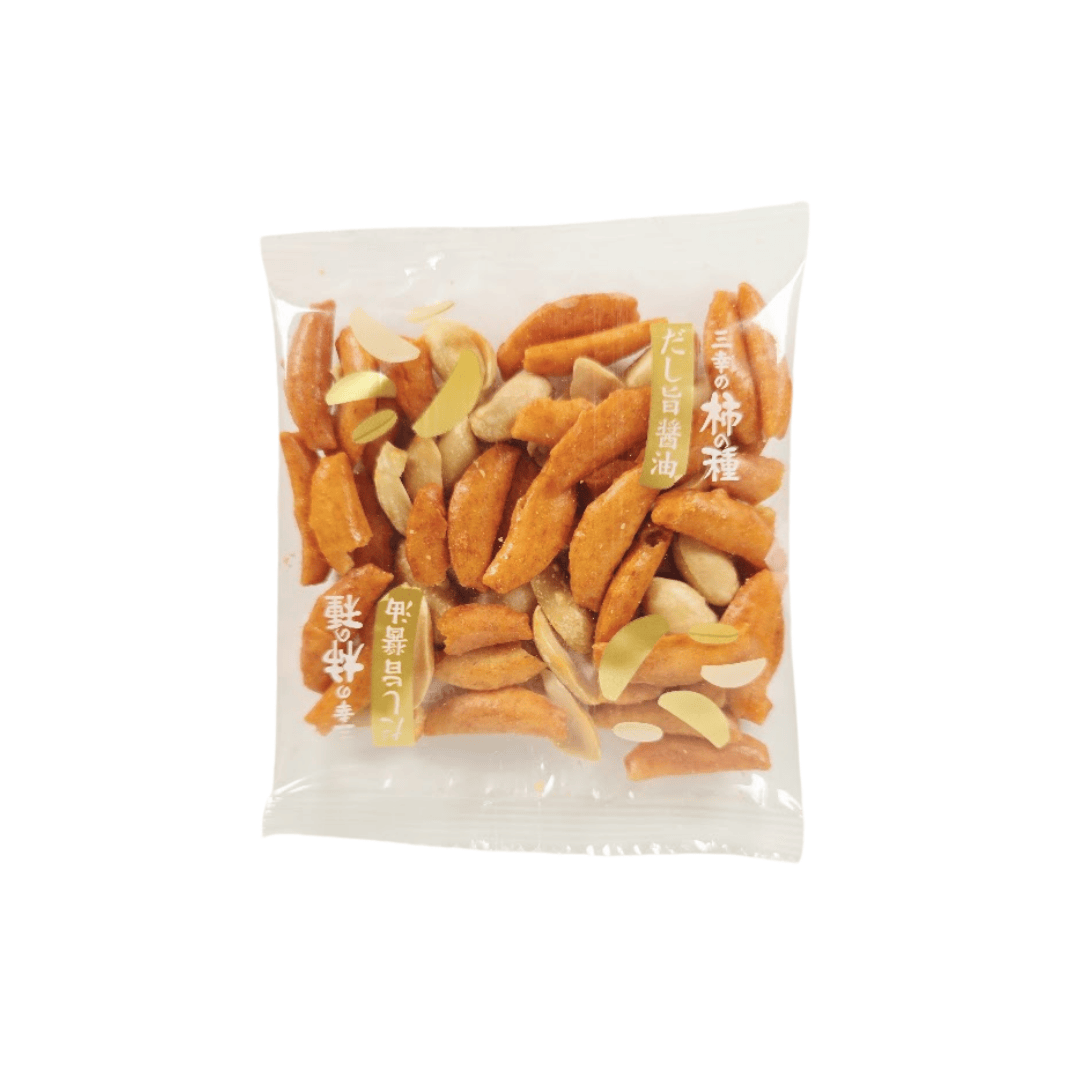 A clear plastic package containing a mix of Sanko Kakinotane rice crackers and peanuts. The packaging features Japanese text and small golden peanut illustrations.