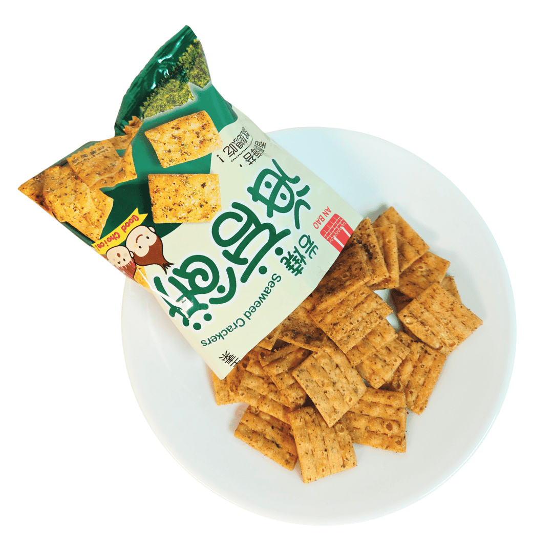 Packaged seaweed crackers on a white plate