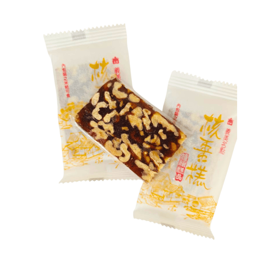Walnut date thin bar snack from Taiwan on top of two wrapped snack bars
